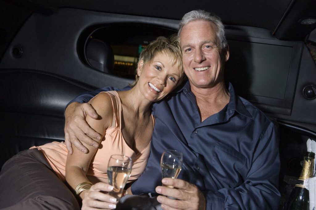 Couple enjoying a limousine ride